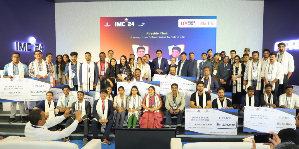 The AI School team group photo on stage
